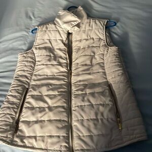 Cream vest will match everything in your closet.